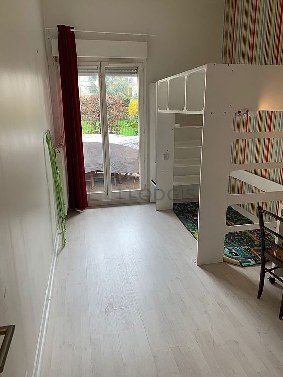 Bedroom with wooden floor