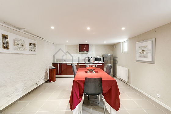Kitchen equipped with washing machine, dryer, refrigerator, extractor hood