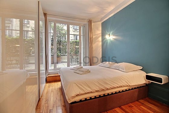 Bedroom with wooden floor