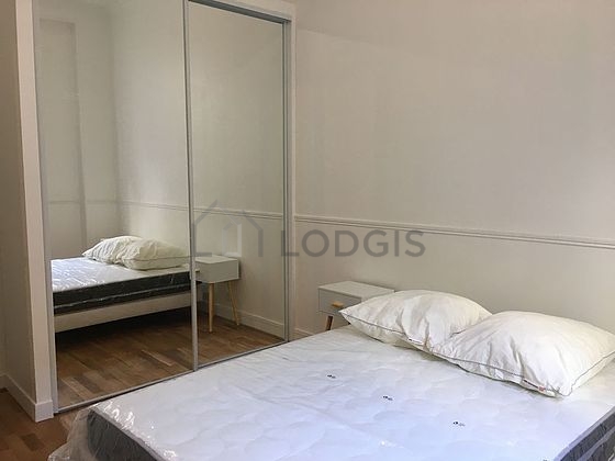 Bedroom with wooden floor