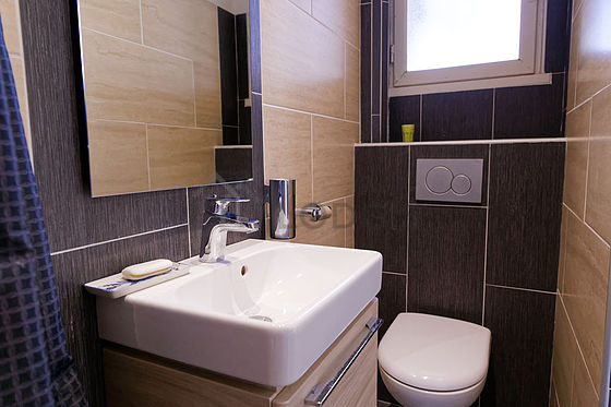 Bathroom equipped with washing machine, bath towels