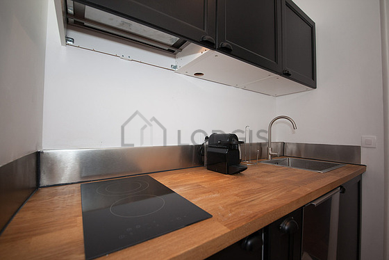 Kitchen equipped with dishwasher, hob, refrigerator, freezer
