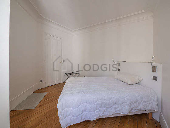Very bright bedroom equipped with storage space