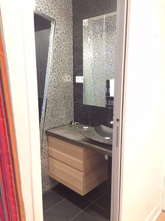 Bathroom equipped with washing machine, dryer, bath towels