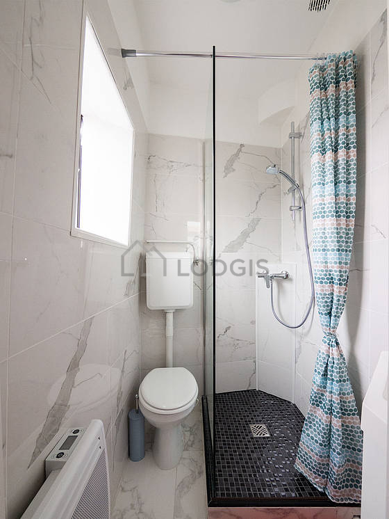 Pleasant and bright bathroom with tile floor