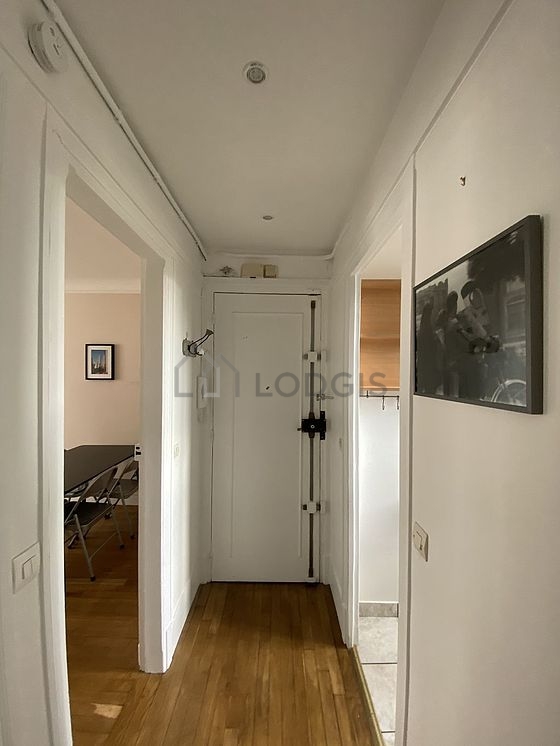 Kitchen equipped with dishwasher, hob, refrigerator, extractor hood