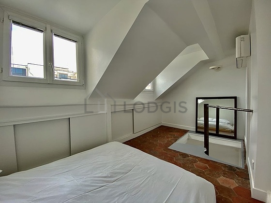 Very bright bedroom equipped with air conditioning, wardrobe
