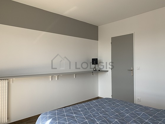 Bedroom equipped with cupboard, bedside table