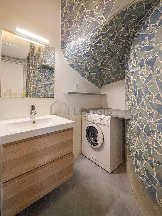 Bathroom equipped with washing machine, shelves