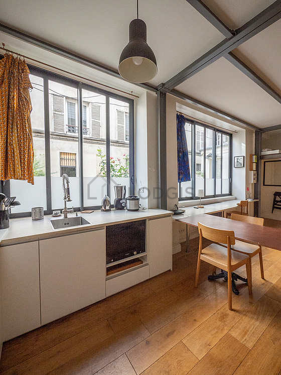 Bright kitchen facing the courtyard