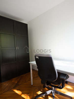 Very beautiful office with woodenfloor furnished with 1 armchair(s), closet