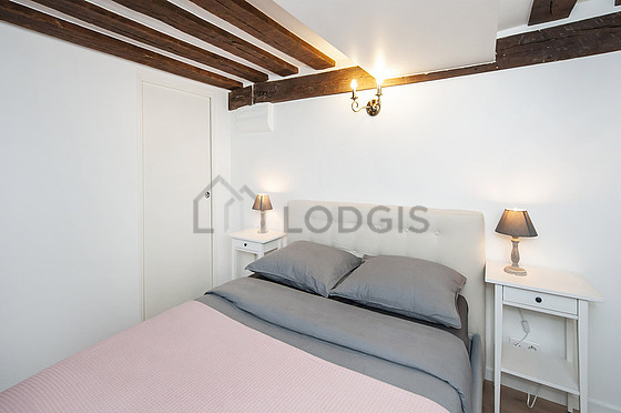 Very bright bedroom equipped with wardrobe, cupboard, bedside table