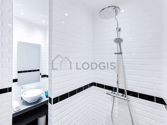 Bathroom equipped with separate shower, towel drying radiator