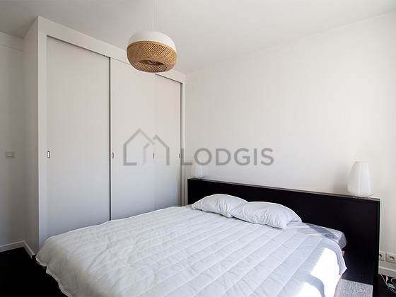 Bedroom with windows facing the road