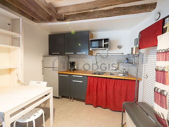Kitchen equipped with washing machine, refrigerator, freezer, crockery