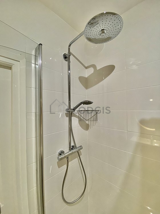 Bathroom equipped with washing machine, bath towels