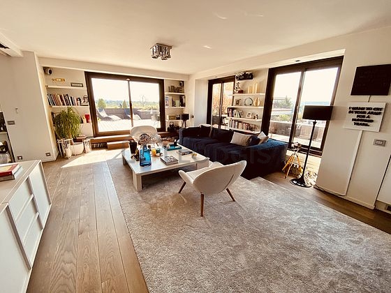 Very quiet living room furnished with tv, dvd player, 1 armchair(s), 8 chair(s)
