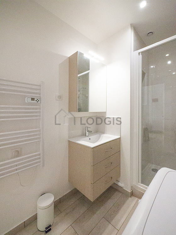 Bathroom equipped with washing machine, dryer, cupboard
