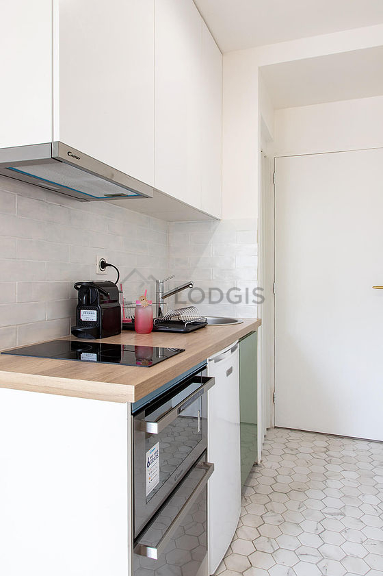 Kitchen equipped with dishwasher, hob, refrigerator, freezer