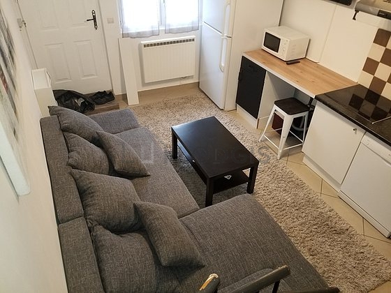 Kitchen equipped with dishwasher, hob, refrigerator, extractor hood