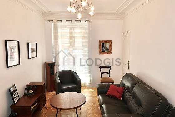 Very quiet living room furnished with tv, 2 armchair(s)