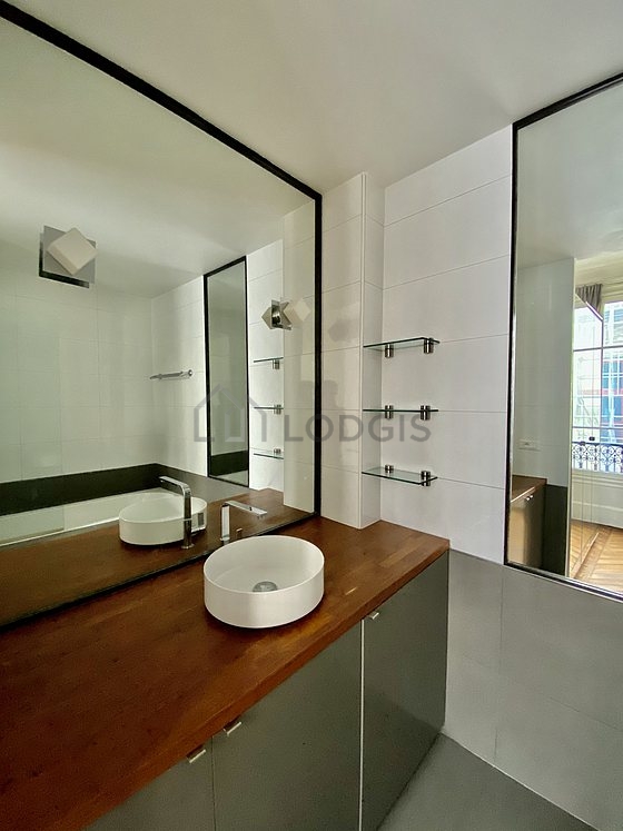 Pleasant and very bright bathroom with tile floor