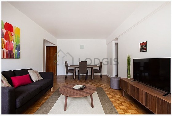 Quiet living room furnished with tv, 1 armchair(s), 1 chair(s)