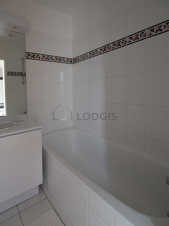 Bathroom equipped with dryer, shelves