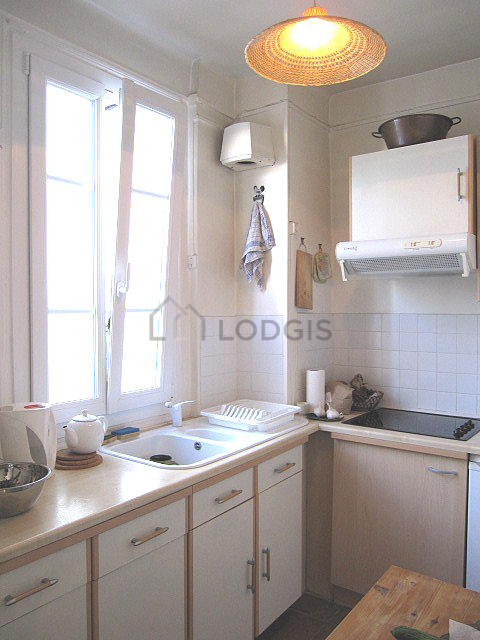 Kitchen where you can have dinner for 2 person(s) equipped with hob, refrigerator, freezer, extractor hood