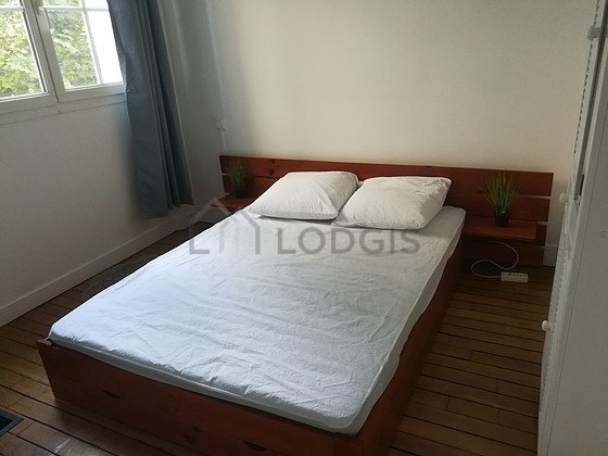Bedroom with wooden floor