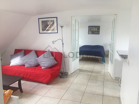 Living room furnished with 1 sofabed(s) of 140cm, tv