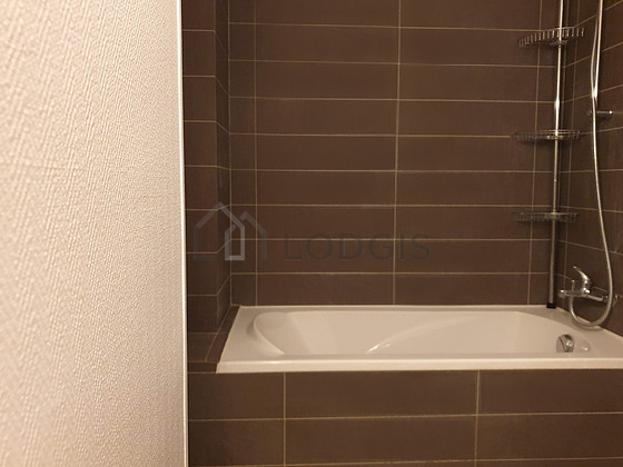 Beautiful and bright bathroom with double-glazed windows and with tile floor
