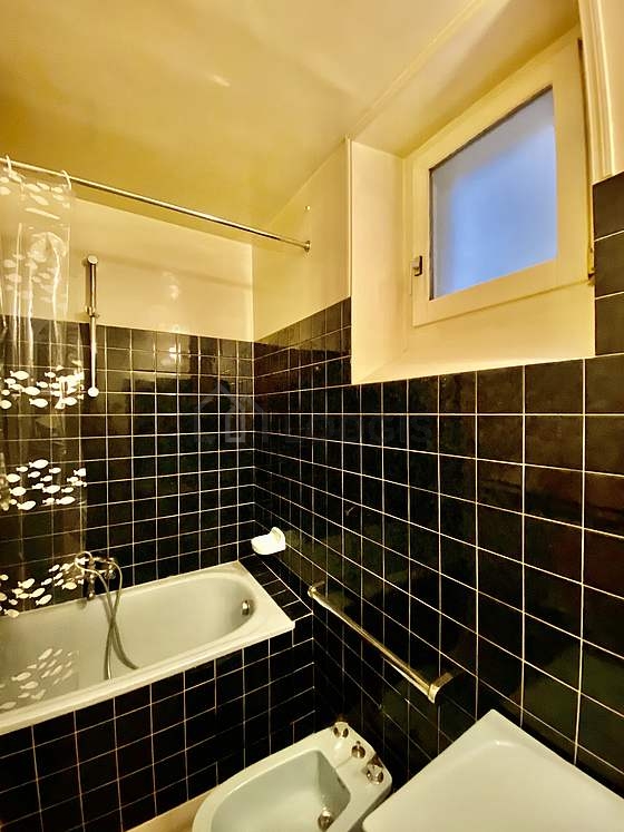 Pleasant and very bright bathroom with tile floor