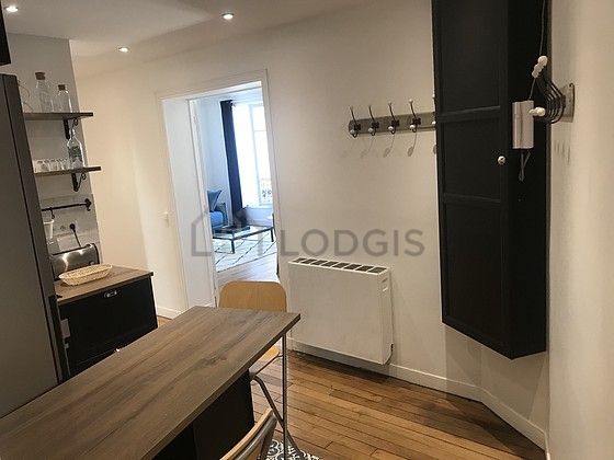Kitchen equipped with washing machine, refrigerator, extractor hood, crockery