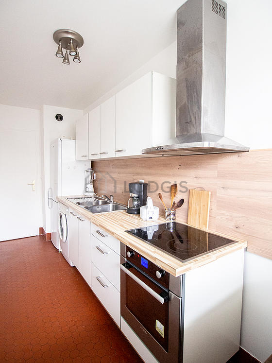 Kitchen where you can have dinner for 2 person(s) equipped with washing machine, refrigerator, extractor hood, crockery