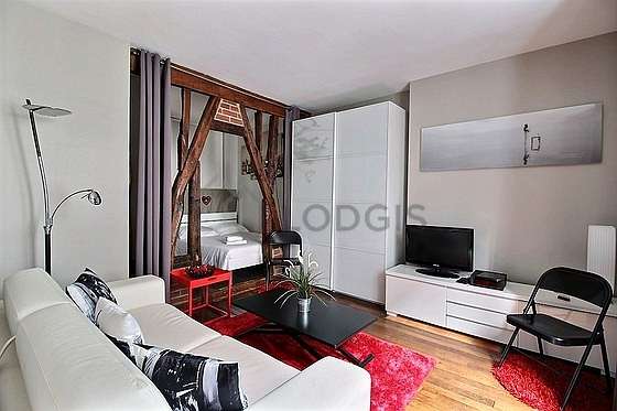 Very quiet living room furnished with tv, closet, 1 chair(s)