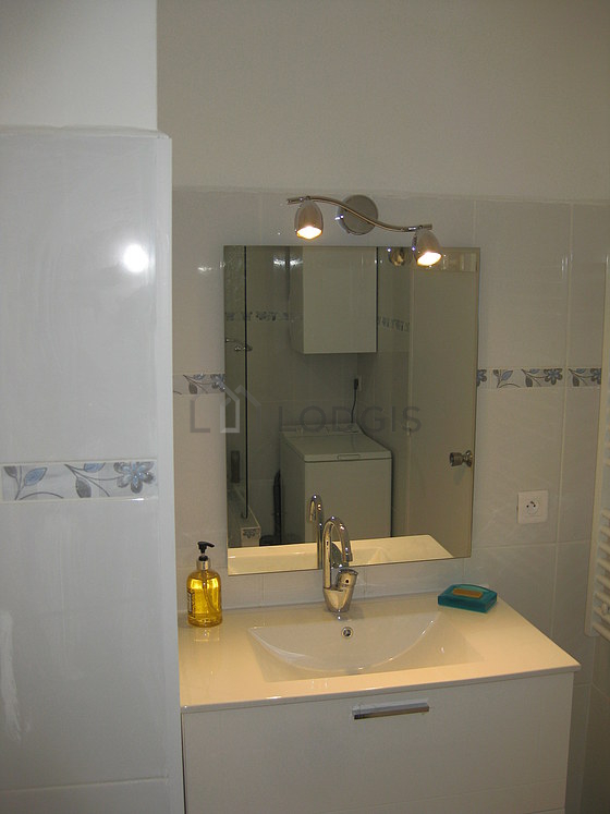 Bathroom equipped with washing machine, bath towels