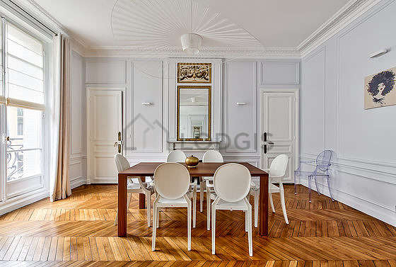 Dining room equipped with dining table, fireplace