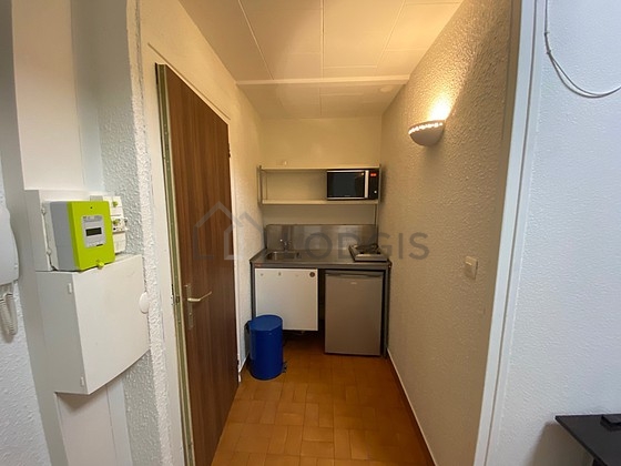 Kitchen equipped with hob, refrigerator