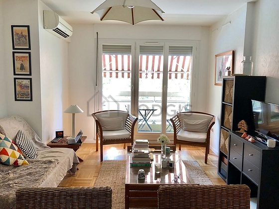 Living room furnished with tv, 1 armchair(s), 1 chair(s)