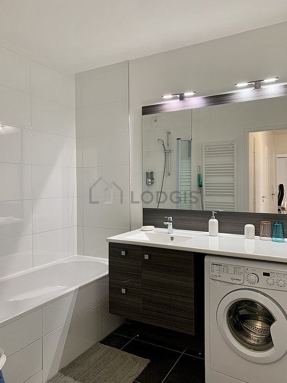 Pleasant and very bright bathroom with tile floor
