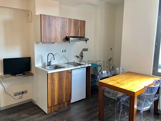 Kitchen equipped with hob, extractor hood