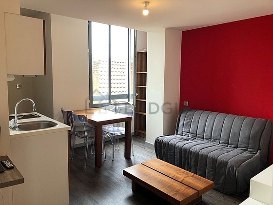 Living room furnished with 1 sofabed(s) of 130cm