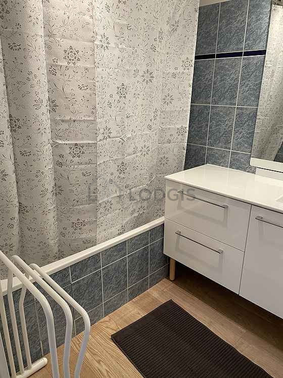 Bathroom equipped with washing machine, shelves