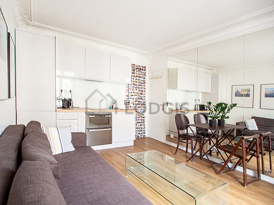 Living room with double-glazed windows facing the road