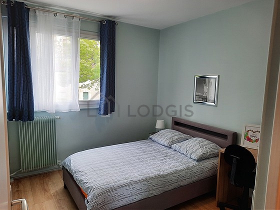 Bedroom with wooden floor