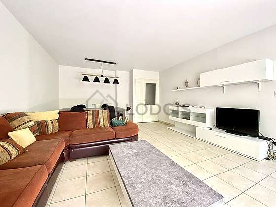 Very quiet living room furnished with tv, cupboard, 5 chair(s)