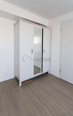 Very bright bedroom equipped with cupboard