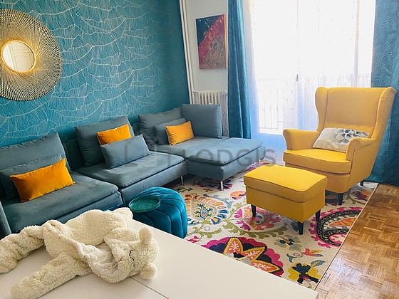 Very quiet living room furnished with tv, 1 armchair(s), 1 chair(s)