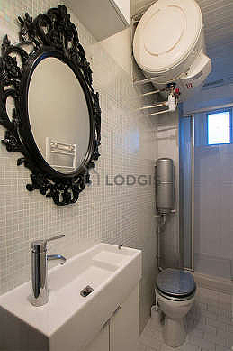 Pleasant and very bright bathroom with tile floor